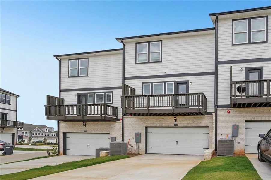 Front exterior of a new home in Hemingway - Highland Series, Cumming, GA, highlighting curb appeal (Image 23). Front exterior of a new home in Hemingway - Highland Series, Cumming, GA, highlighting curb appeal (Image 23).