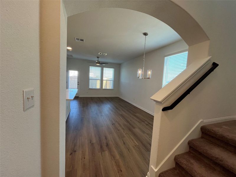 An inviting open floorplan provides a seamless flow from the entryway to the living area.