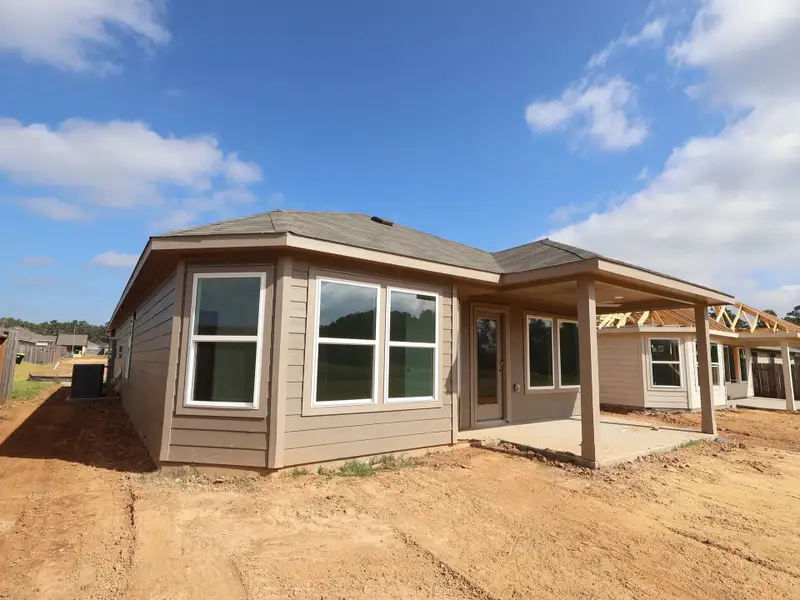 Exterior details and patio area of a home in Magnolia Ridge, Magnolia (Image 4). Exterior details and patio area of a home in Magnolia Ridge, Magnolia (Image 4).