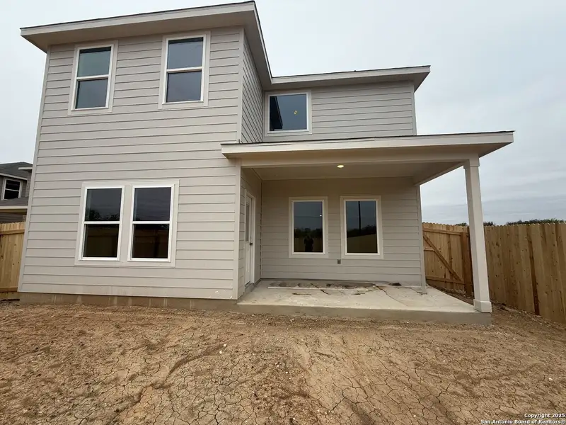 Exterior details and patio area of a home in Meadows at Hennersby Hollow 40's, San Antonio (Image 3).