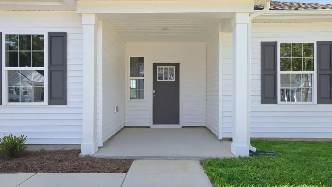 Exterior details and patio area of a home in Tyler - Home on the Lake, New Bern (Image 3).