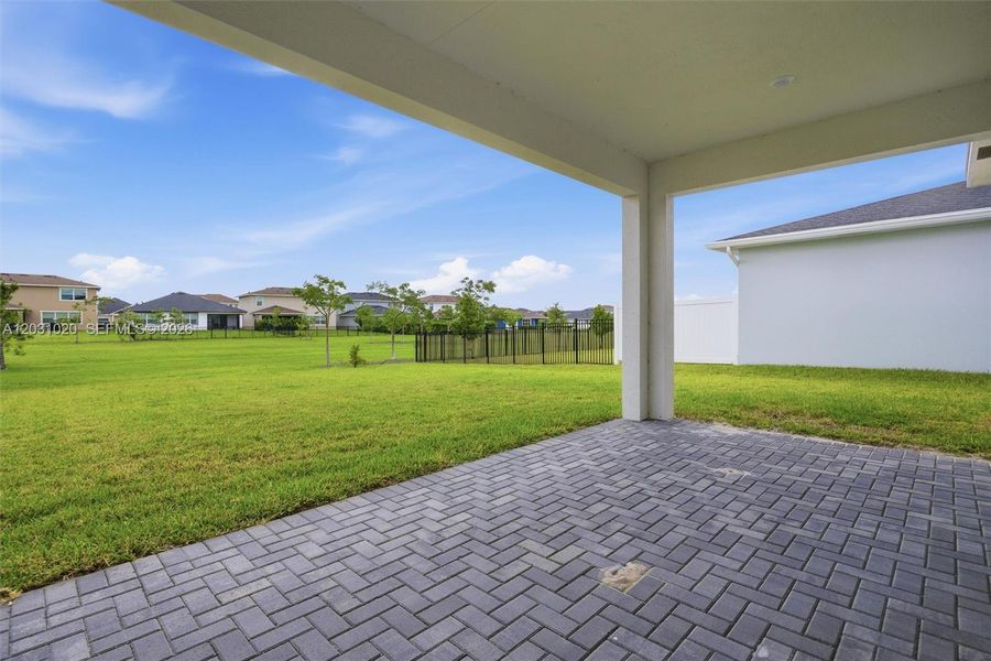 Exterior details and patio area of a home in Arden, Loxahatchee (Image 21).