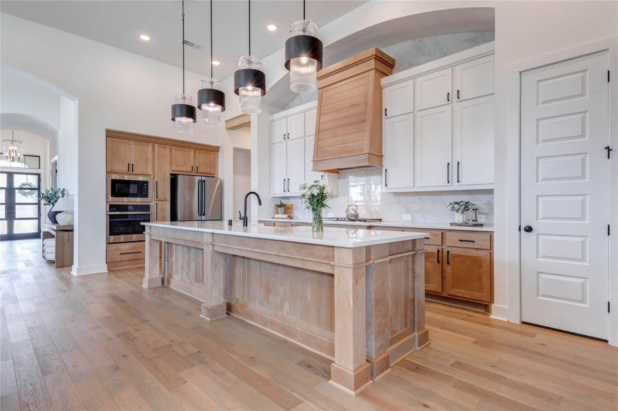 A dream kitchen with all cabinetry, pendant lights and high quality details. A dream kitchen with all cabinetry, pendant lights and high quality details.