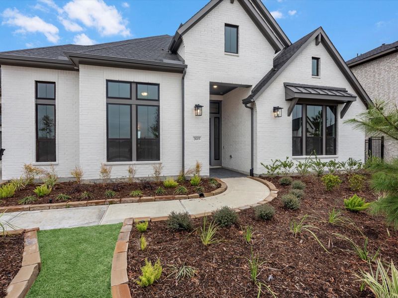 Front exterior of a new home in Woodson’s Reserve, Spring, TX, highlighting curb appeal (Image 20).