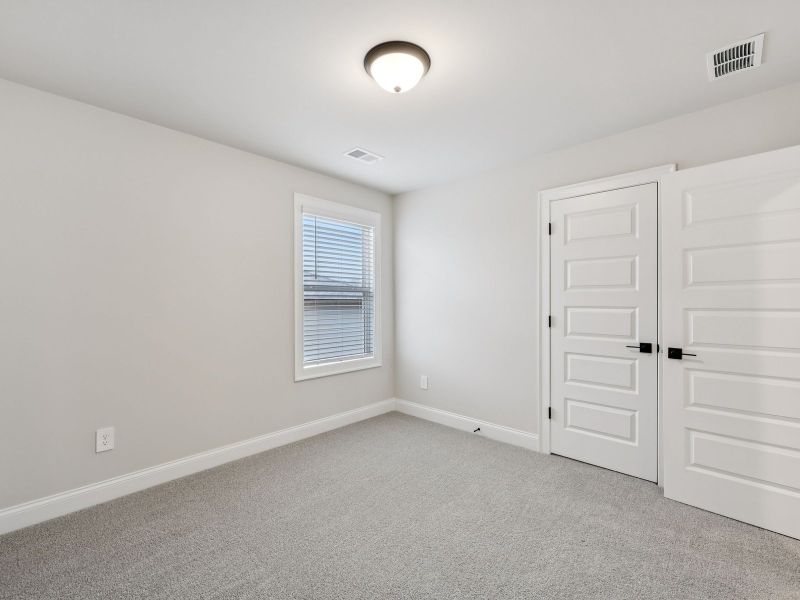 Spacious, unfurnished interior of a new home in Vines at Mill Creek - Estate Series, Braselton (Image 18).