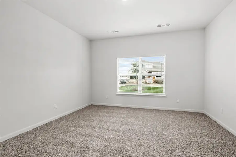 Unfurnished room with light carpet and baseboards
