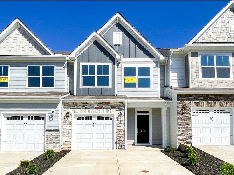 Front exterior of a new home in Riverbrooke Townhomes, Simpsonville, SC, highlighting curb appeal (Image 1). Front exterior of a new home in Riverbrooke Townhomes, Simpsonville, SC, highlighting curb appeal (Image 1).