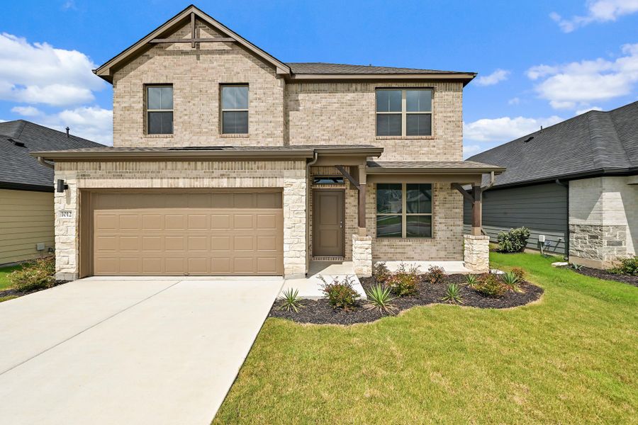 Front exterior of a new home in Prairie Winds, Hutto, TX, highlighting curb appeal (Image 20).