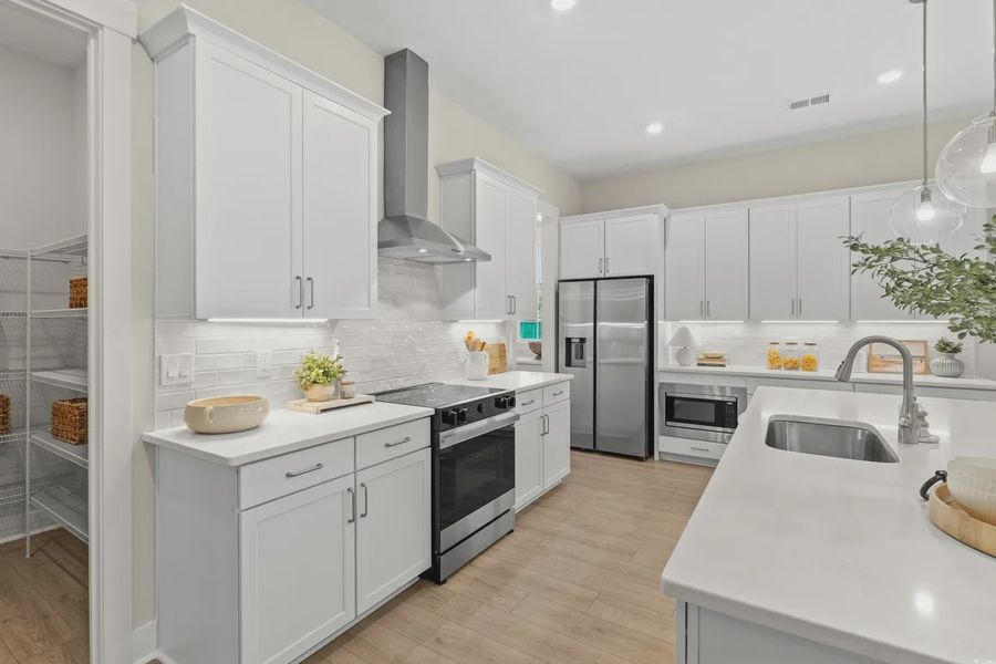 Furnished interior view inside a new home in Long Bay Golf Club, Longs (Image 7).