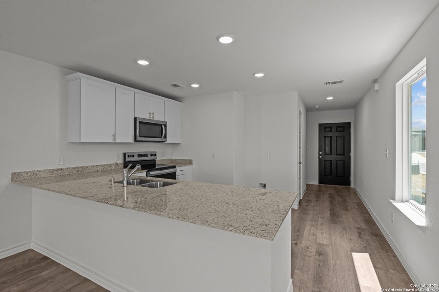 Furnished interior view inside a new home in Vista Real, Converse (Image 6).