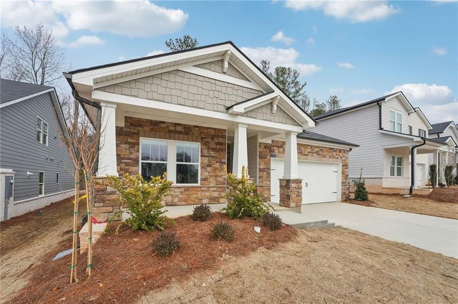 Front exterior of a new home in Westmont Preserve, Powder Springs, GA, highlighting curb appeal (Image 26).