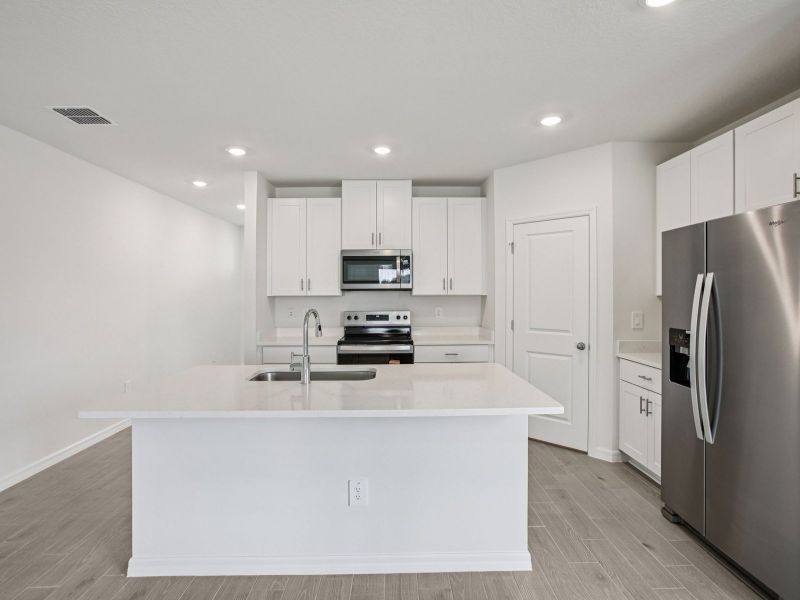 Furnished interior view inside a new home in Two Rivers - Classic Series, Zephyrhills (Image 4).