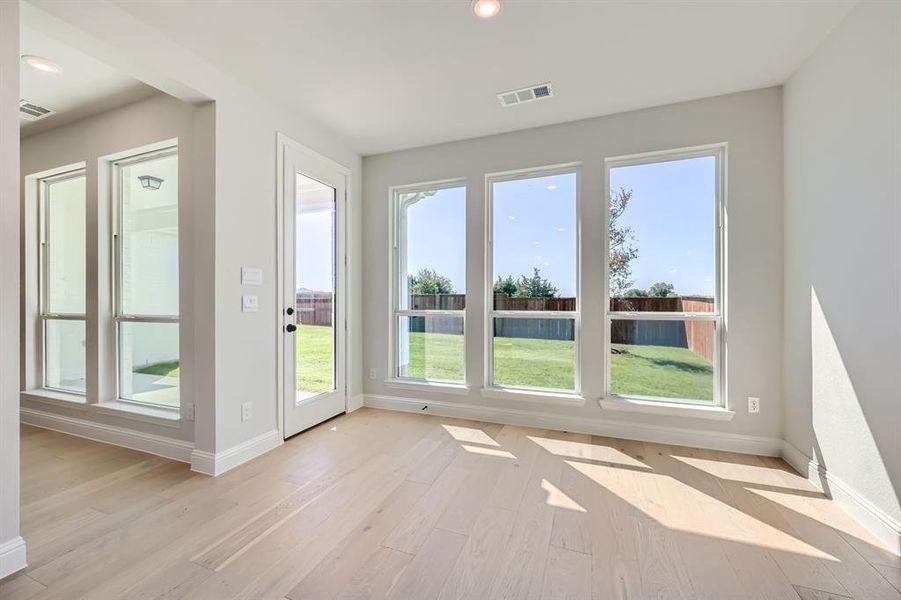 Empty room featuring light wood-type flooring