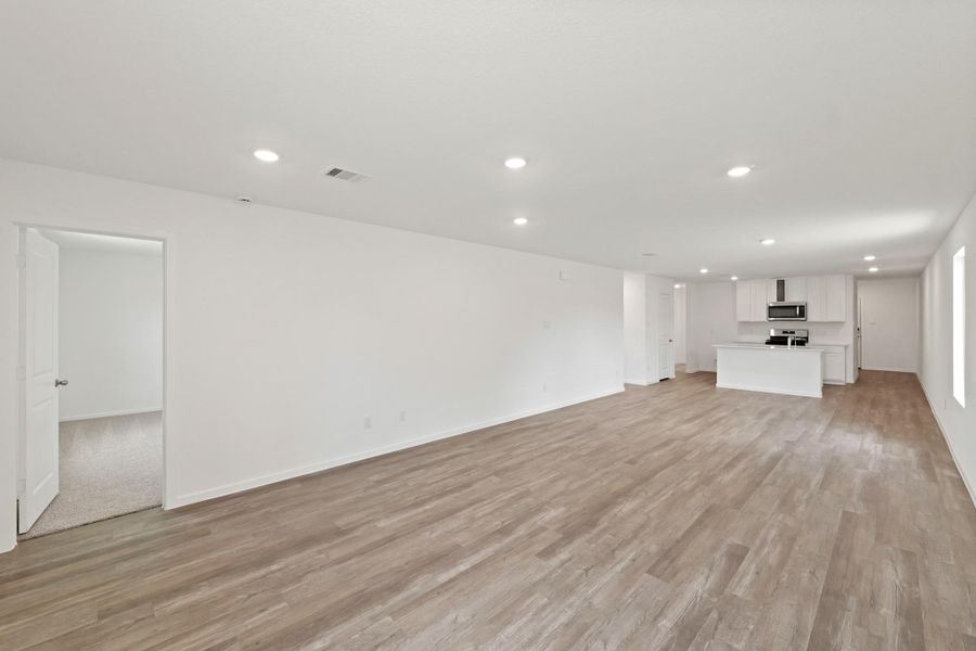 Spacious, unfurnished interior of a new home in The Canopies, Splendora (Image 8).