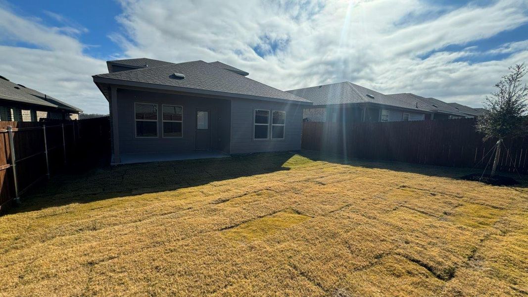 Exterior details and patio area of a home in Monarch at the Meadows, Krum (Image 3).