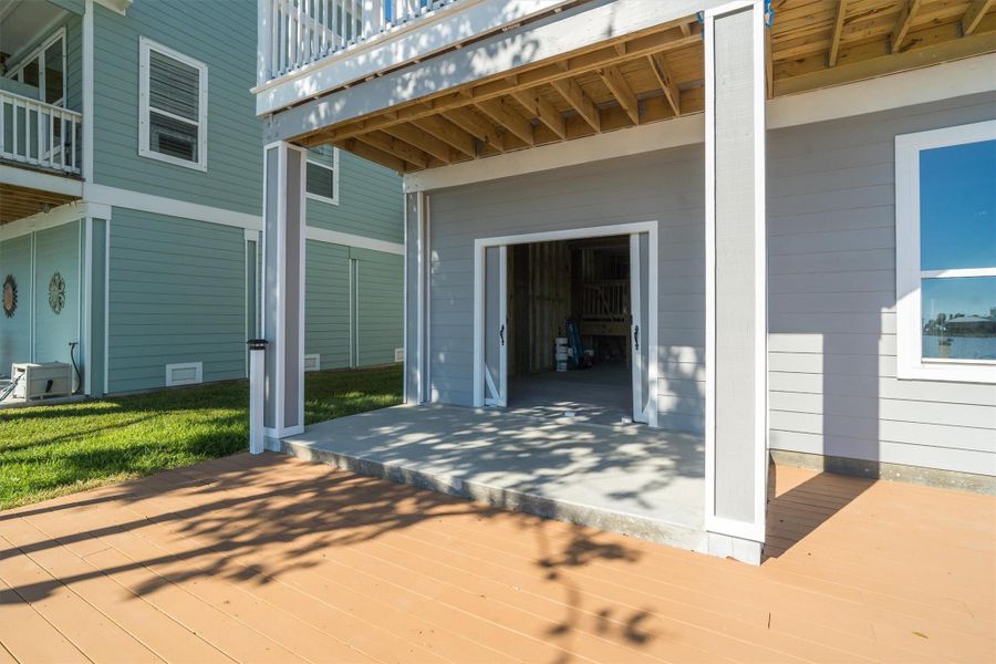 Barn doors from the garage leading to the outdoor waterfront deck Barn doors from the garage leading to the outdoor waterfront deck