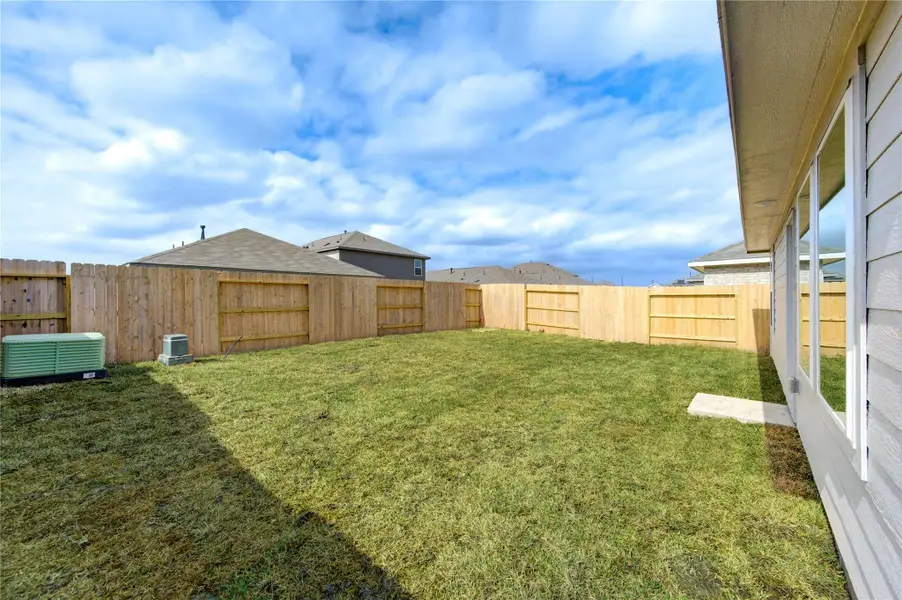 Backyard with plenty of space to relax, entertain, or create your own outdoor retreat