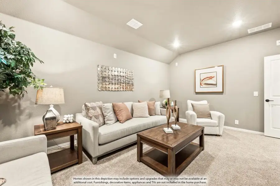 Living room with vaulted ceiling, beige sofa, wood coffee table, and carpet flooring