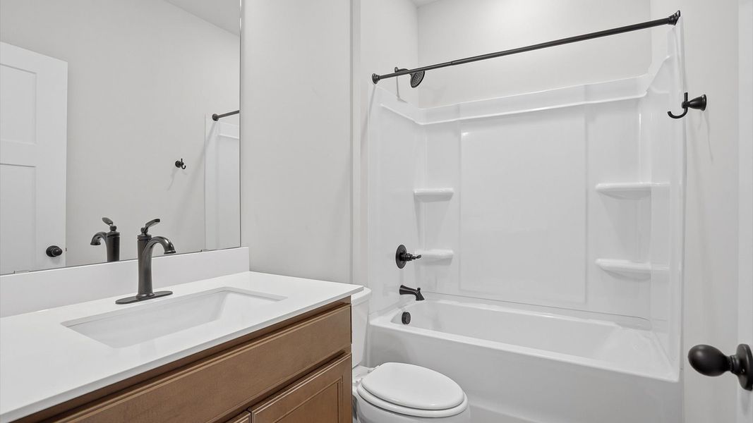 Notable full bathroom offering tasteful details and a bright, functional space at the Pelham Crossing community