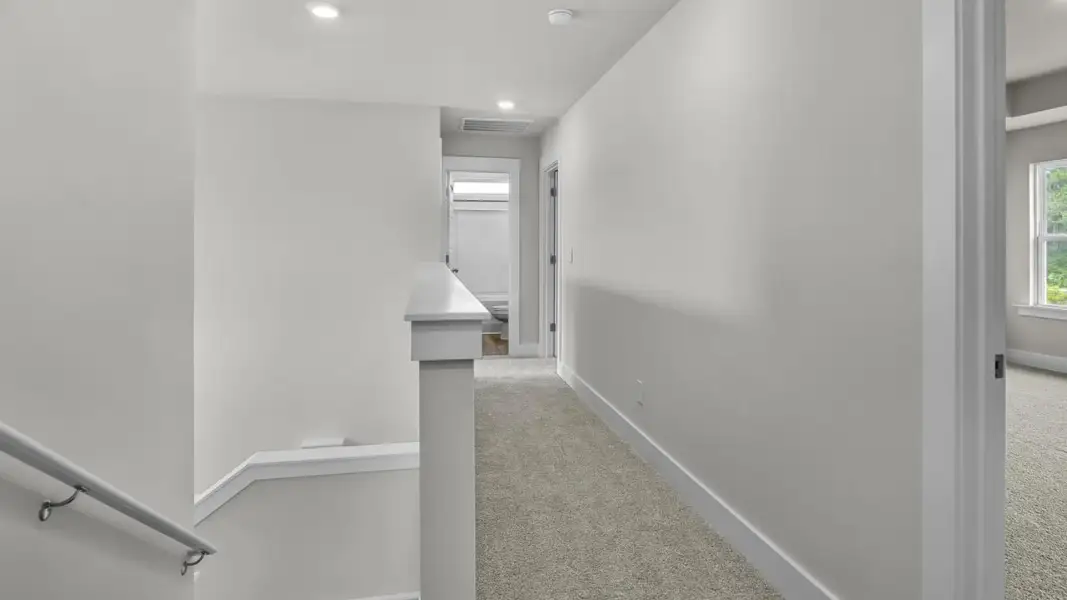 Representative unfurnished interior of a home built from the Forrester by D.R. Horton in The Highlands at Cedar Hill Landing, Navassa (Image 24).