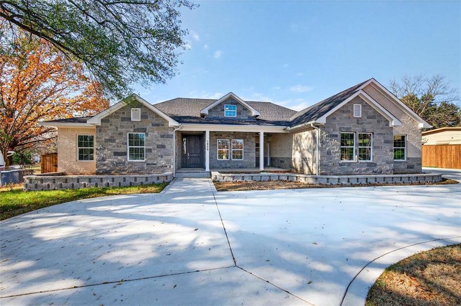 Front exterior of a new home in , Denison, TX, highlighting curb appeal (Image 25). Front exterior of a new home in , Denison, TX, highlighting curb appeal (Image 25).