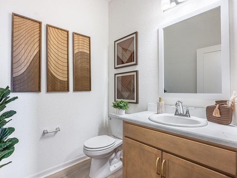 And, a convenient powder room is located near your main living area - Monroe by Highland Homes And, a convenient powder room is located near your main living area - Monroe by Highland Homes