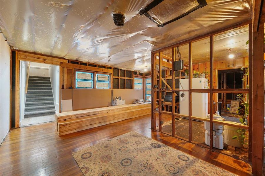 Living Area, looking toward steps. Kitchen wall on the right