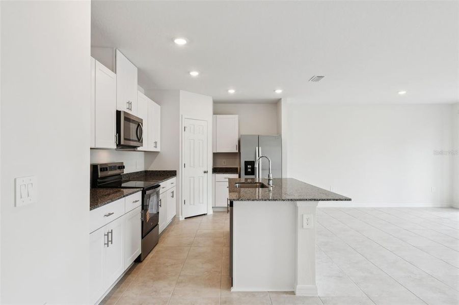 Furnished interior view inside a new home in Bradbury Creek - Signature Series, Haines City (Image 6).
