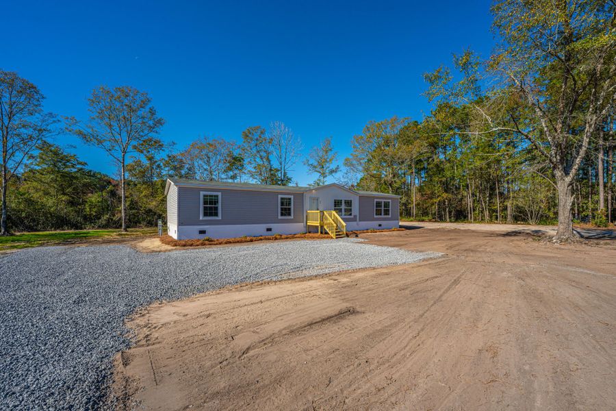 Exterior details and patio area of a home in , Pinopolis (Image 22).