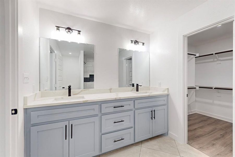 Bathroom featuring vanity and hardwood / wood-style flooring