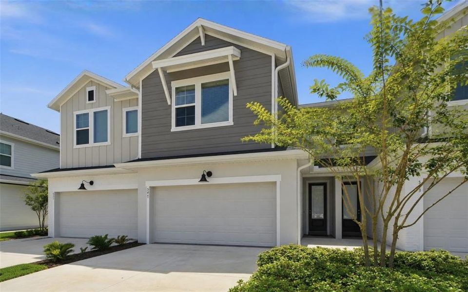 Front exterior of a new home in , Lake Mary, FL, highlighting curb appeal (Image 2). Front exterior of a new home in , Lake Mary, FL, highlighting curb appeal (Image 2).
