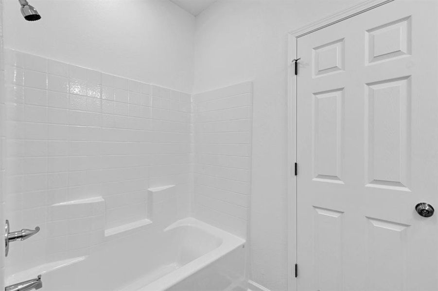 Full bath featuring bathing tub / shower combination Full bath featuring bathing tub / shower combination