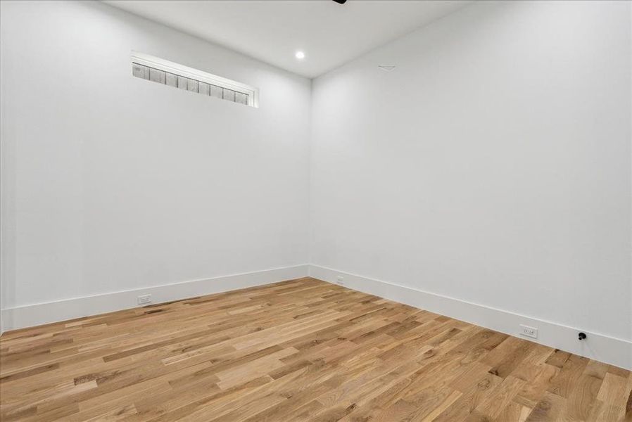 Empty room featuring light wood-type flooring