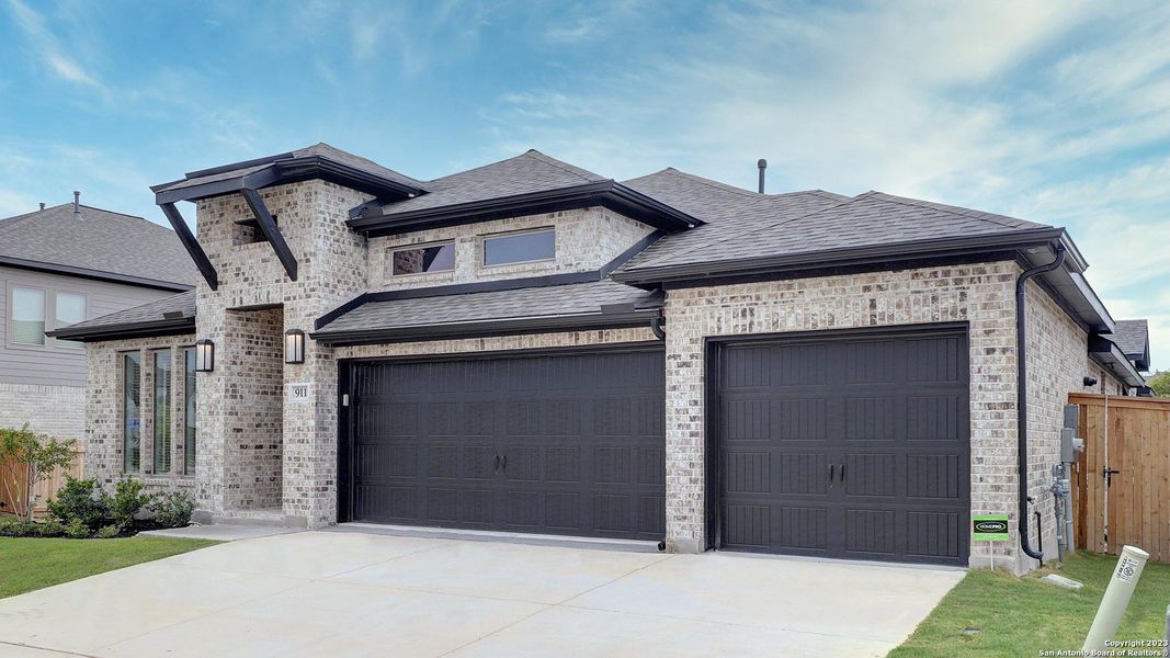 Front exterior of a new home in Weston Oaks 55', San Antonio, TX, highlighting curb appeal (Image 21). Front exterior of a new home in Weston Oaks 55', San Antonio, TX, highlighting curb appeal (Image 21).