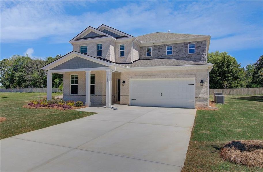 Front exterior of a new home in Bowers Farm, McDonough, GA, highlighting curb appeal (Image 18). Front exterior of a new home in Bowers Farm, McDonough, GA, highlighting curb appeal (Image 18).