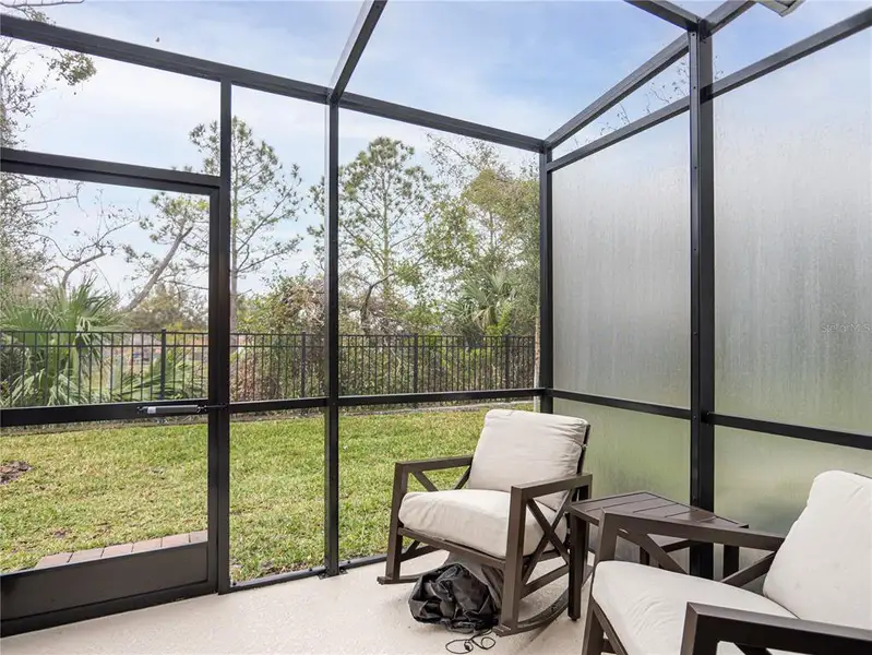 Exterior details and patio area of a home in Towns at Tuskawilla Commons, Oviedo (Image 23).