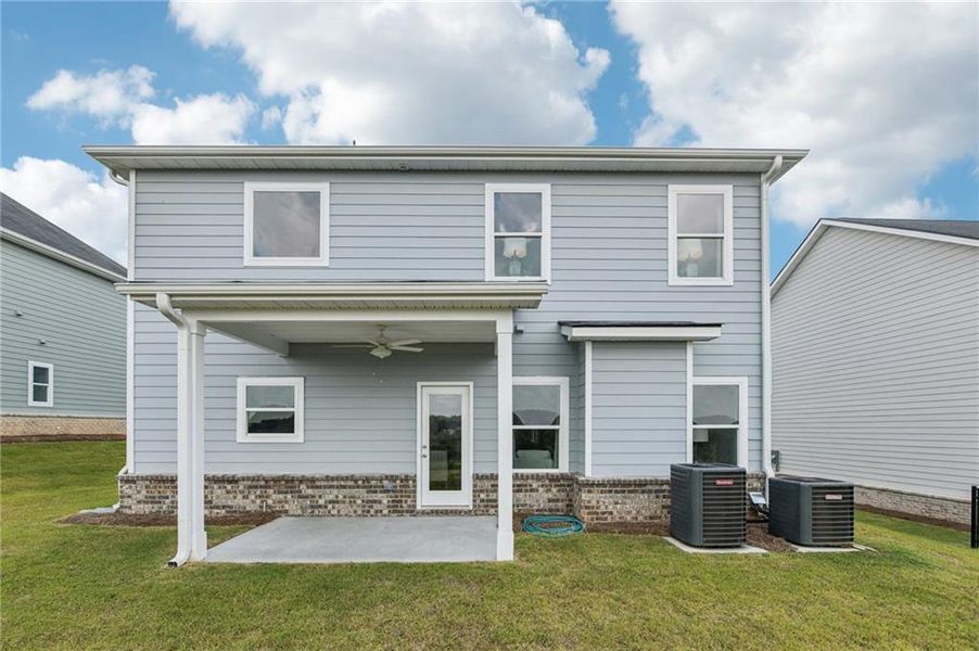 Exterior details and patio area of a home in The Hills at Cedar Creek, Winder (Image 23).