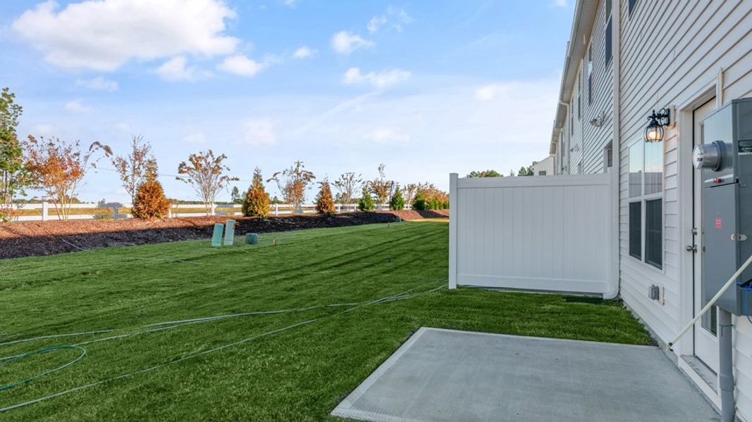 Front exterior of a new home in Brightwood Farm, Whitsett, NC, highlighting curb appeal (Image 16).