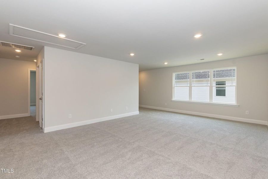 Representative unfurnished interior of a home built from the 2709 by Adams Homes in The Grove at Ballard, Jacksonville (Image 28).
