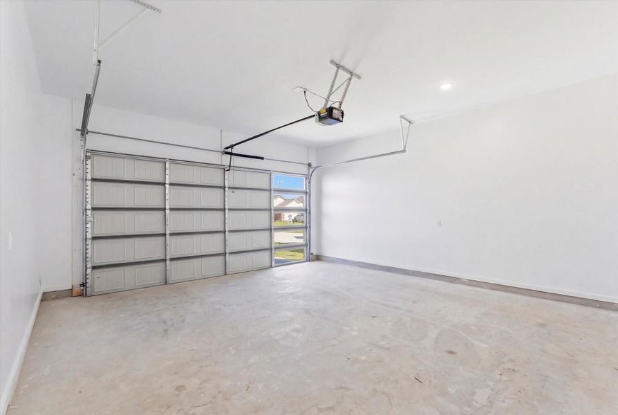 Conveniently located off the laundry room, the garage includes windows within the garage door for added natural light and comes equipped with an automatic garage door opener.