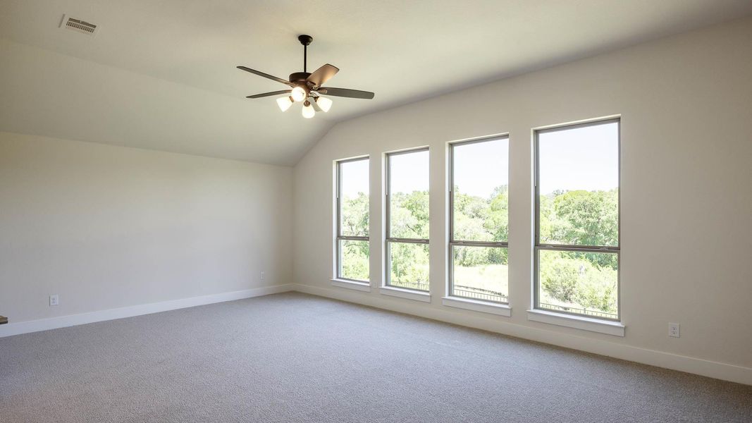 Bonus room featuring light colored carpet, lofted ceiling, and ceiling fan Bonus room featuring light colored carpet, lofted ceiling, and ceiling fan