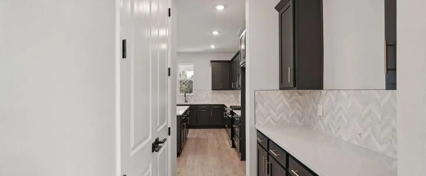 Butler's pantry connecting the dining room and kitchen - representative image this home will feature the AW Collection® Laguna Butler's pantry connecting the dining room and kitchen - representative image this home will feature the AW Collection® Laguna
