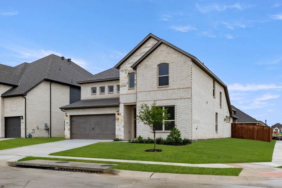 Representative exterior photo of a completed home built from the Winchester by Impression Homes in Timberbrook, Justin, TX (Image 2).