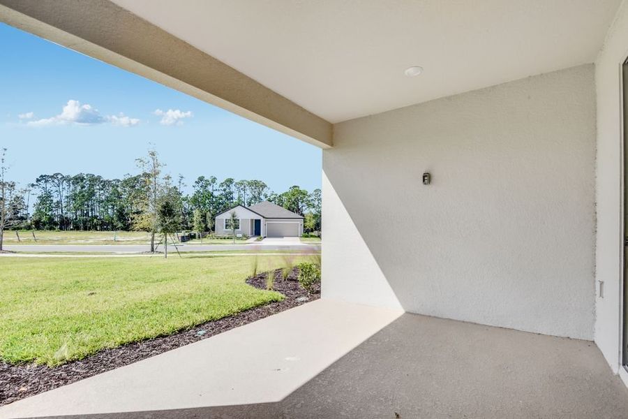 Exterior details and patio area of a home in Ardisia Park, New Smyrna Beach (Image 3).