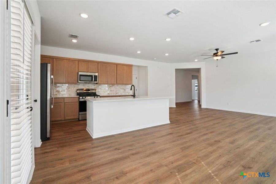 Furnished interior view inside a new home in Village at Three Oaks, Seguin (Image 7).