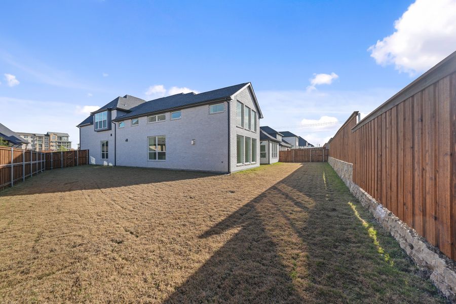 Exterior details and patio area of a home in Estates at Rockhill, Frisco (Image 29). Exterior details and patio area of a home in Estates at Rockhill, Frisco (Image 29).