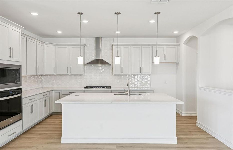 Spacious kitchen with eat-in bartop island Spacious kitchen with eat-in bartop island