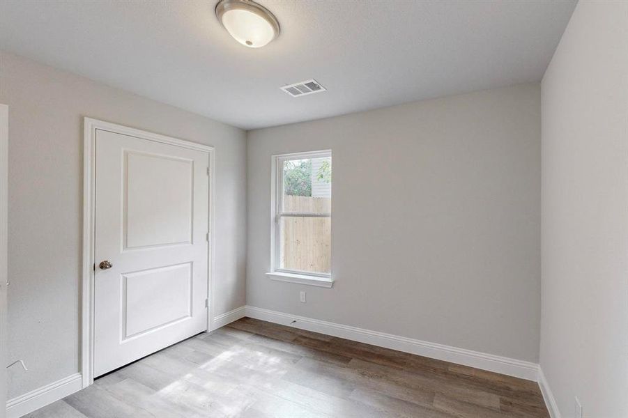 Empty room featuring light wood-type flooring