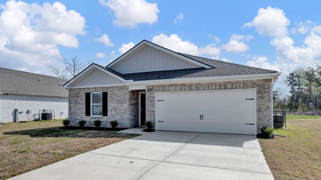Front exterior of a new home in Huntington Estates, Millington, TN, highlighting curb appeal (Image 20).