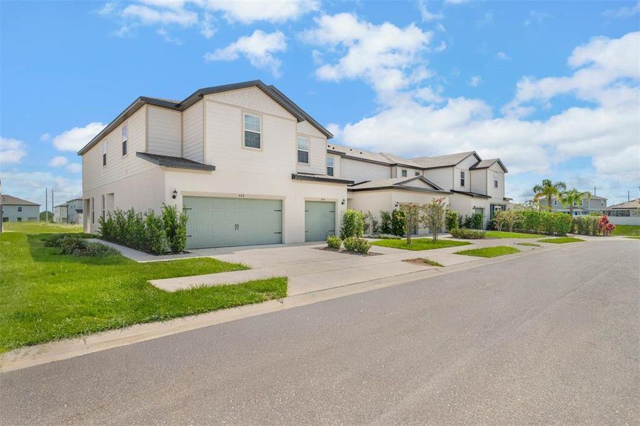 Front exterior of a new home in Sol Vista, Dundee, FL, highlighting curb appeal (Image 2). Front exterior of a new home in Sol Vista, Dundee, FL, highlighting curb appeal (Image 2).